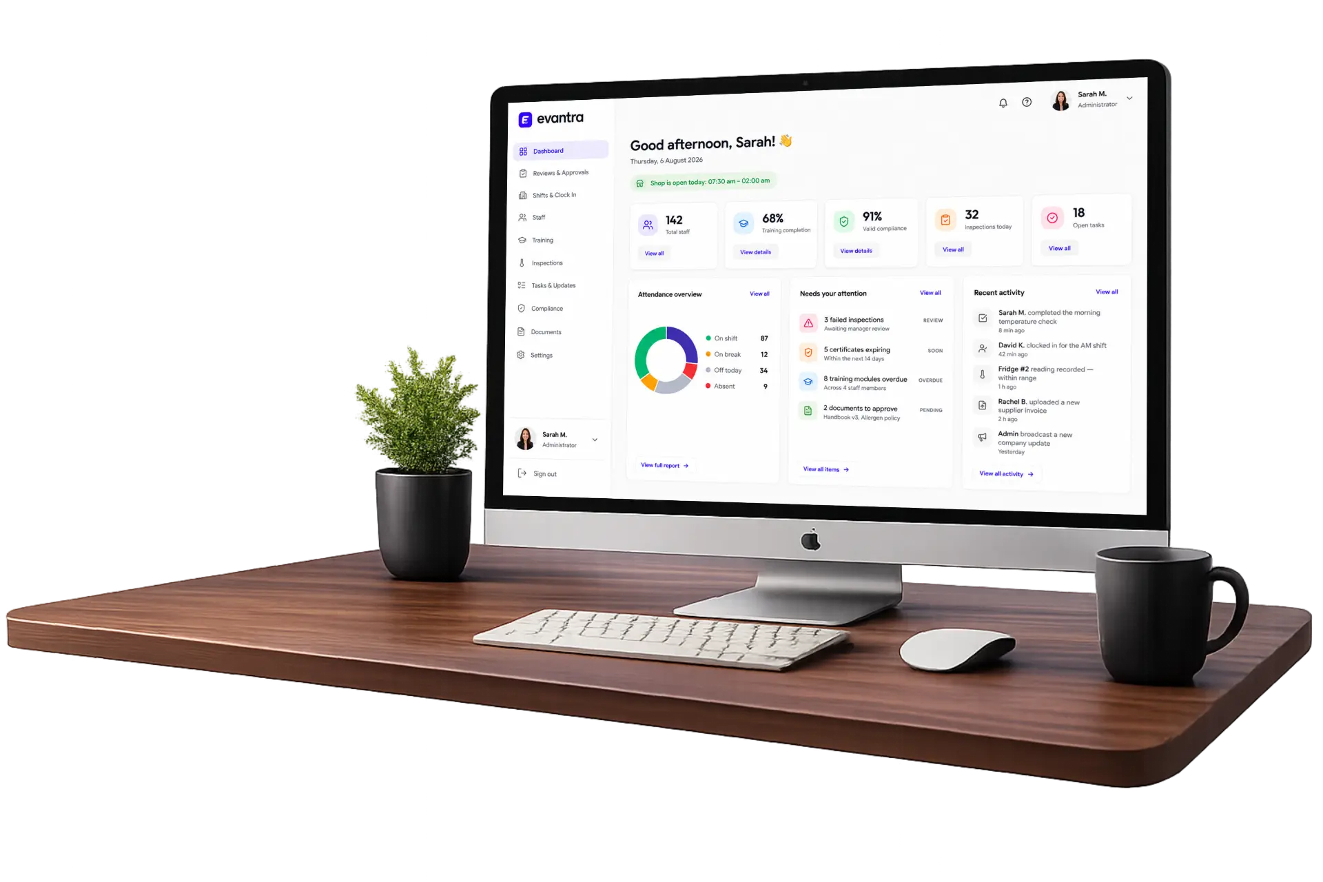 Evantra admin dashboard on a desktop monitor showing attendance, compliance and training at a glance